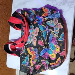Laurel Burch shoulder butterfly bag black with red and bright colors.